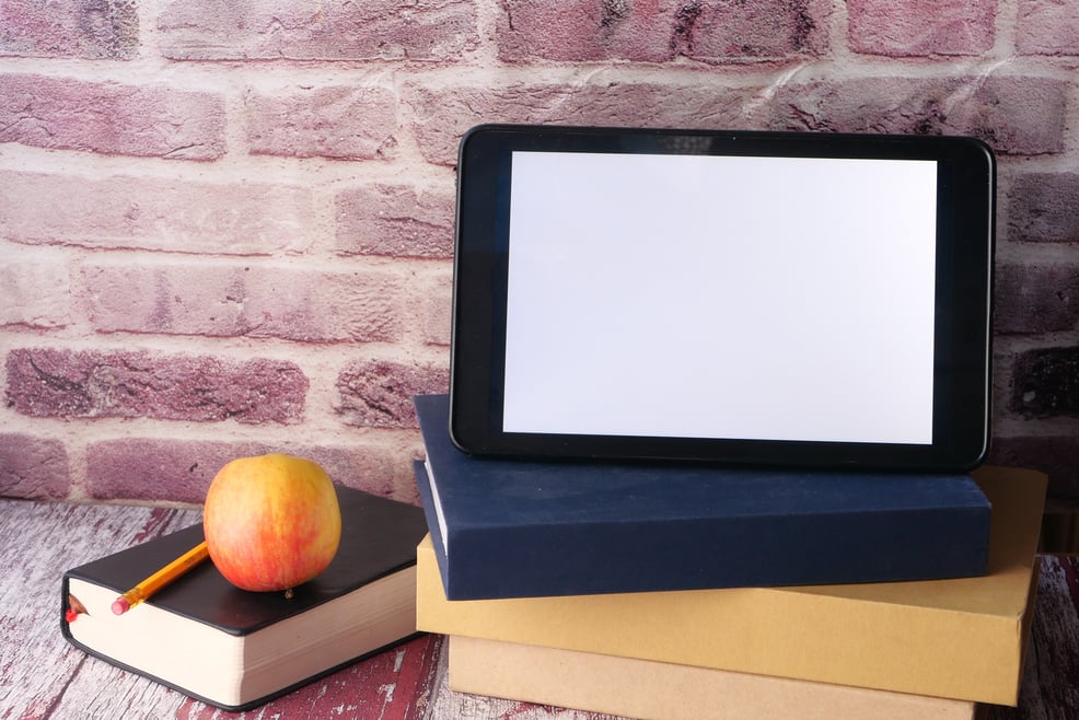 Smart Tablet on Top of Books 