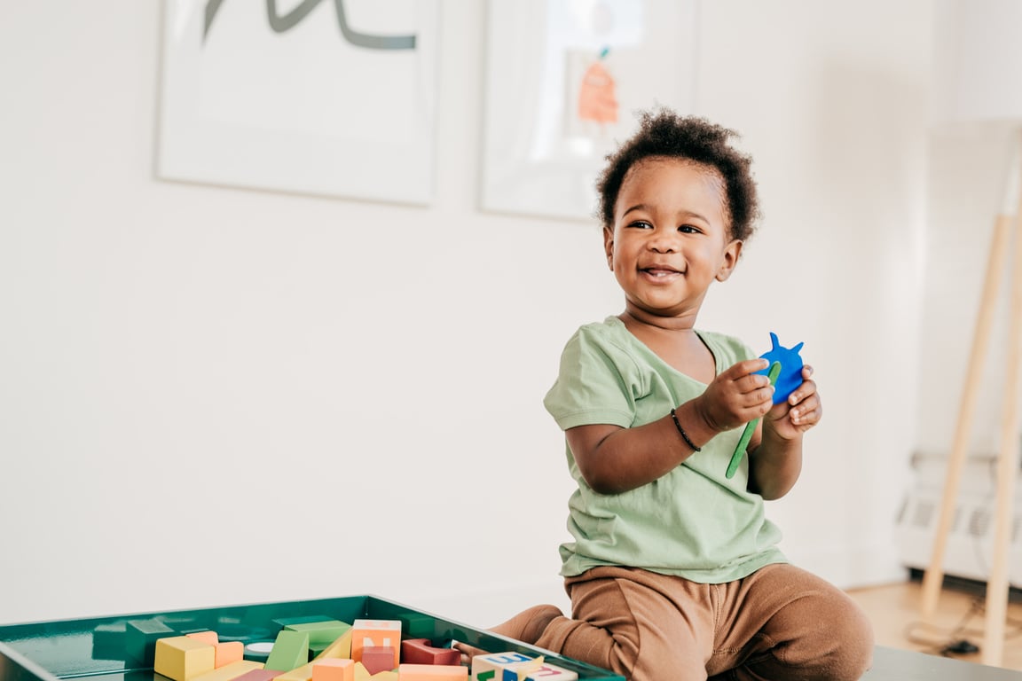 Toddler playing with toy